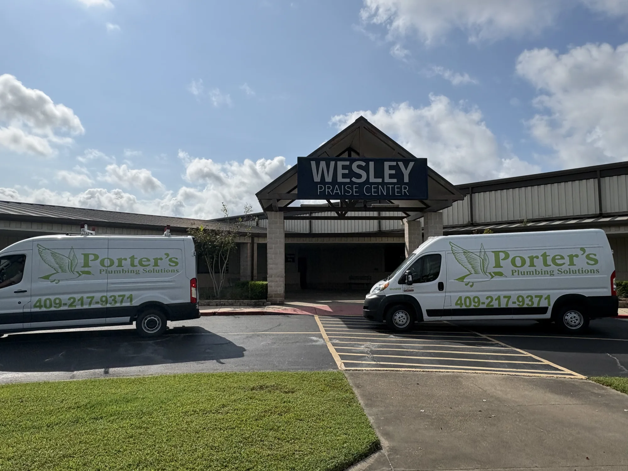 Porter's vans on a commercial AC drain call at Wesley Praise Center in Beaumont, TX