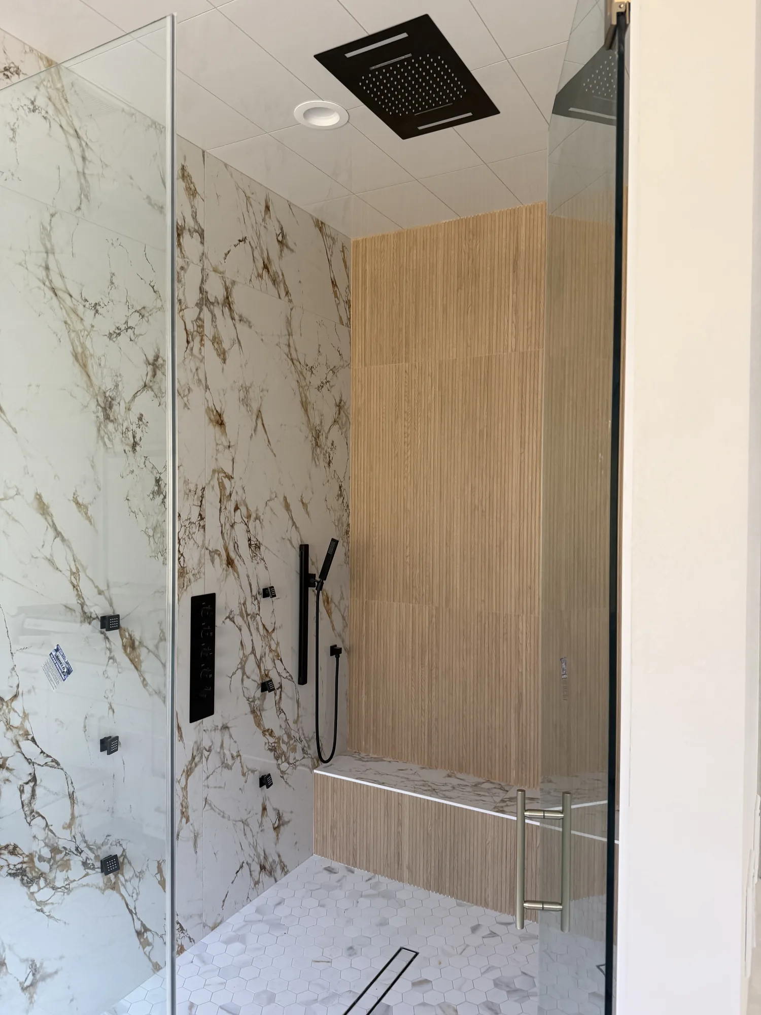 Walk-in shower plumbed and trimmed in a new construction home in Port Neches, TX