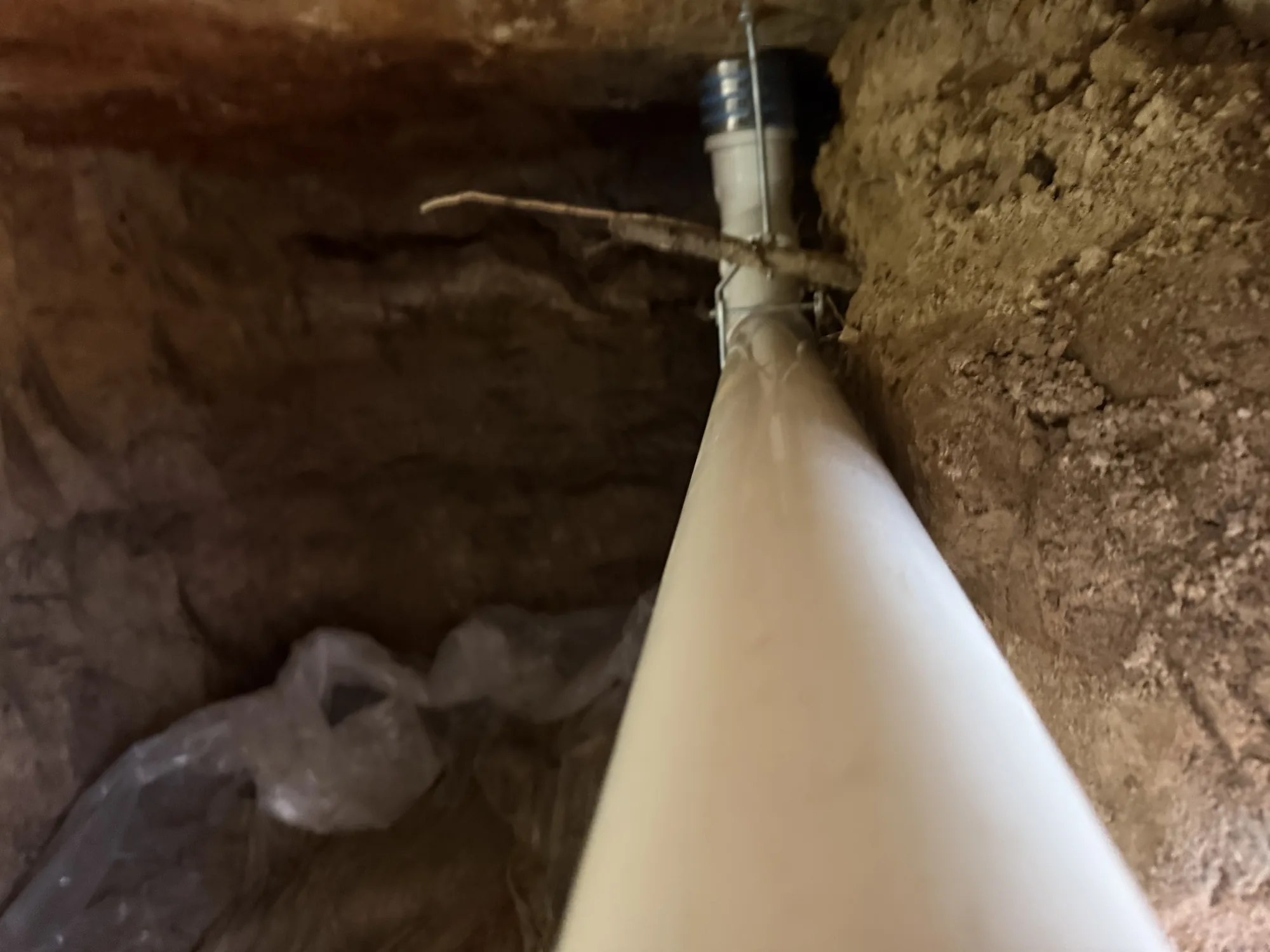 New PVC drain line strapped up under the slab on a Beaumont, TX re-pipe