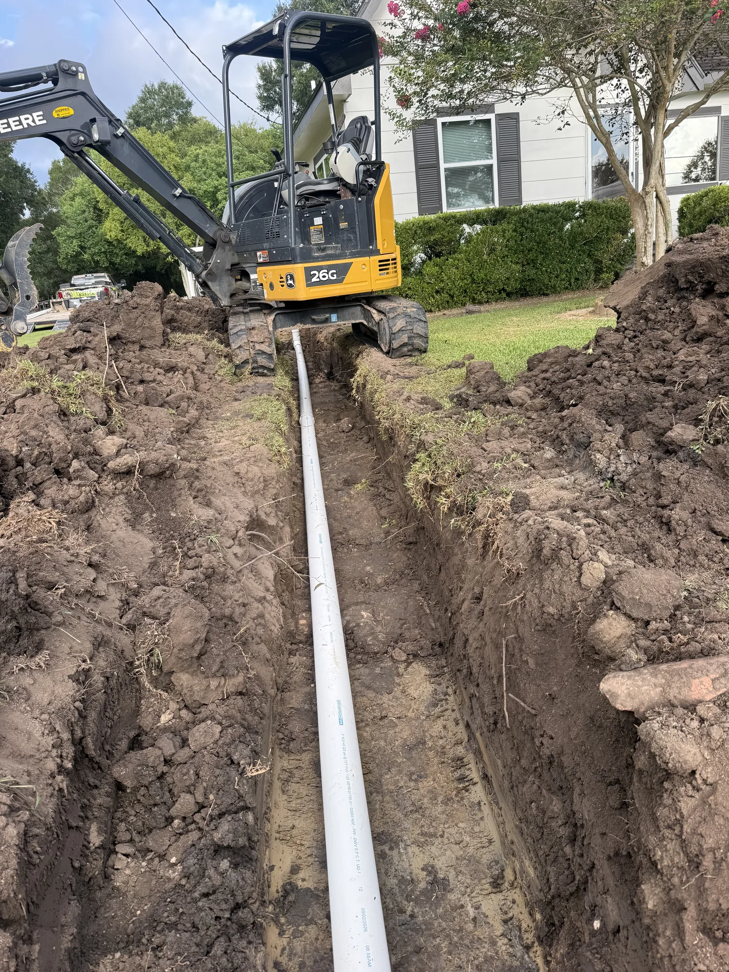 New PVC sewer line laid in an open trench in Port Acres, Port Arthur, TX