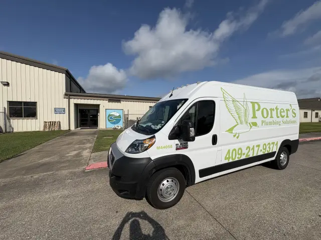 Service van at the Wesley Praise Center education building for a stopped-up AC drain in Beaumont, TX