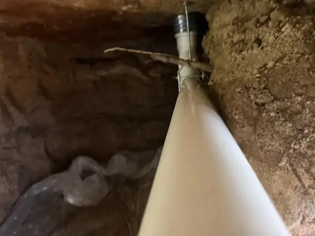 New PVC drain line strapped up under the slab on a Beaumont, TX re-pipe