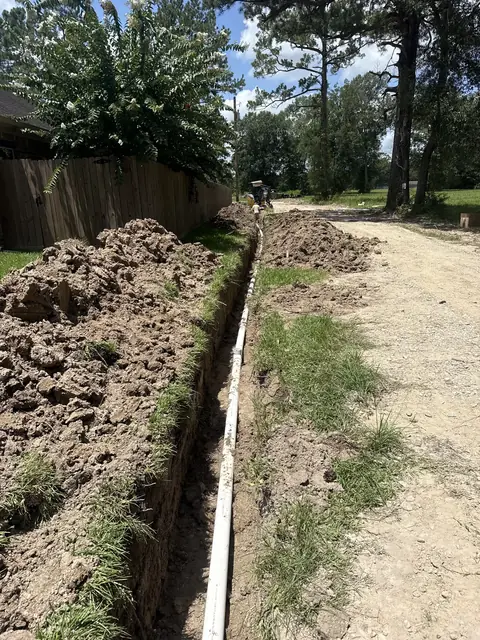 Residential sewer line replacement alongside a home in Sour Lake, TX
