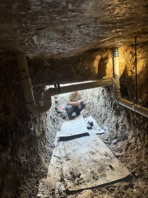 Hand-dug tunnel under a slab foundation in Port Neches, TX