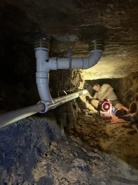 New drain pipe installed inside an under-slab tunnel in Port Neches, TX