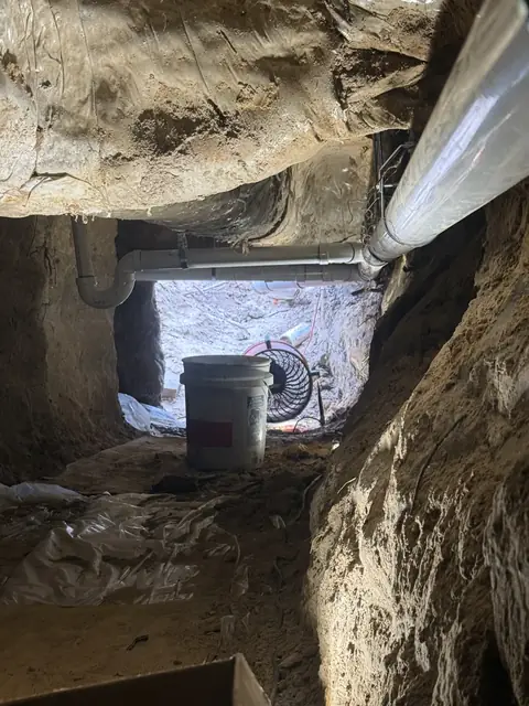 New drain line running the length of an 84-foot tunnel under a Beaumont, TX home